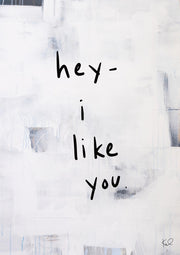 Hand-written black text reading hey I like you over a textured white and grey abstract background