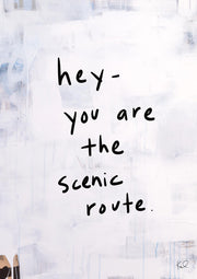 Handwritten black text on a pale abstract white and grey background with faint blue drips