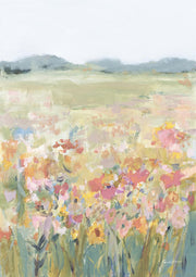 Painterly wildflower meadow in pink, yellow and green tones with muted mountains on a hazy horizon