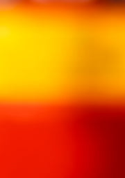 Abstract blurred gradient artwork transitioning from yellow to orange to deep red