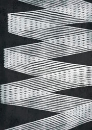 Zigzag striped pattern in white and grey on a black background