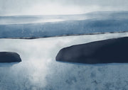 Abstract blue-toned lake landscape with dark rock forms against a misty sky