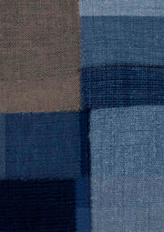 Abstract artwork of woven fabric-textured rectangular blocks in blue tones and taupe brown