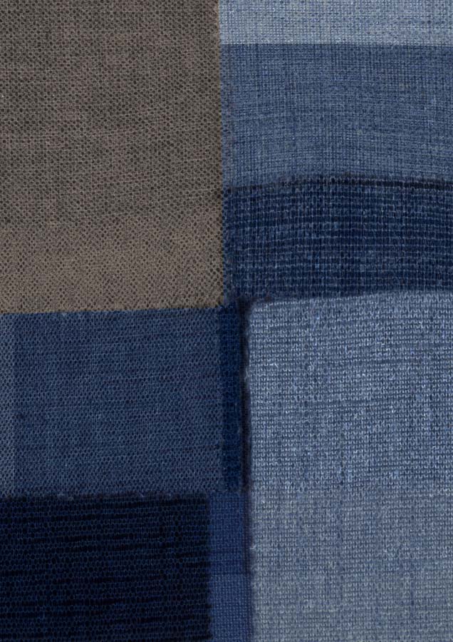 Abstract artwork of woven fabric-textured rectangular blocks in blue tones and taupe brown