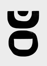 Two stacked black abstract forms with curved cutouts on an off-white background