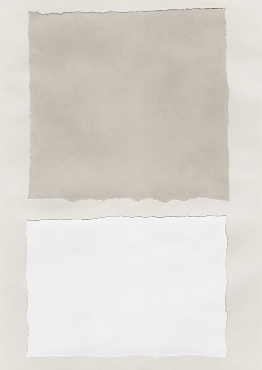 Torn paper collage with a beige rectangle above a white rectangle on a neutral background