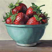 Painting of ripe strawberries in a teal bowl on a wooden table