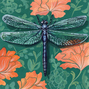 Illustrated dragonfly with green and white wings on a teal background with orange floral pattern.