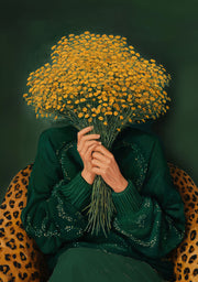 Person holding yellow floral bouquet over face, in green knit, seated in leopard print chair.