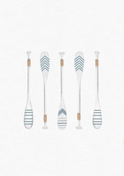 Illustration of five paddles with striped and chevron patterns in blue and tan on a pale background