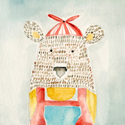 Watercolor illustration of a speckled bear wearing a red propeller hat and overalls