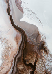 Aerial-style abstract artwork in earth tones with marbled, flowing lines resembling river channels.
